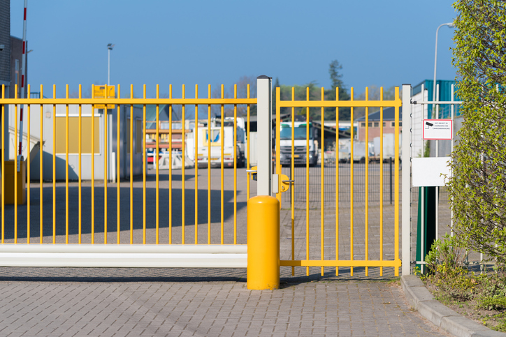 a gate in front of a fence