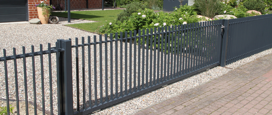 a bench on the side of a fence