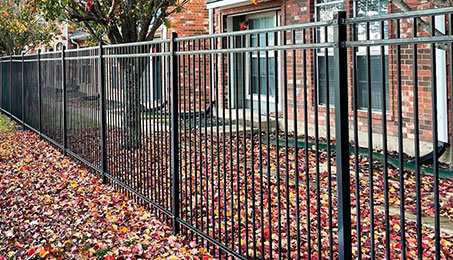 a gate in front of a fence