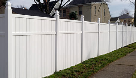 a close up of a fence in front of a building