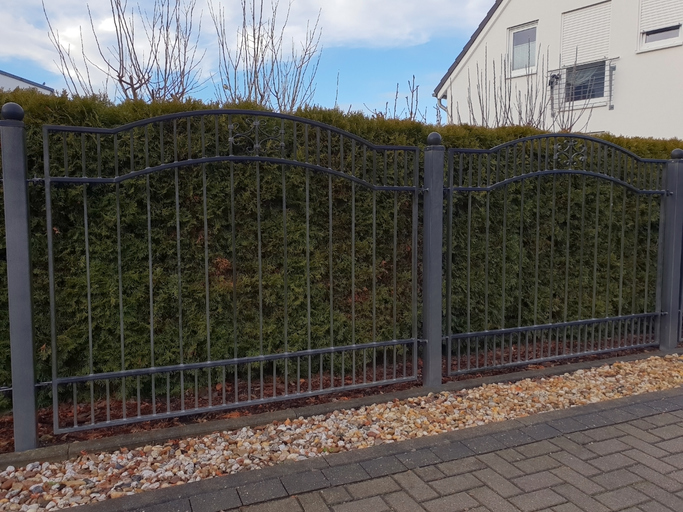 a building with a metal fence