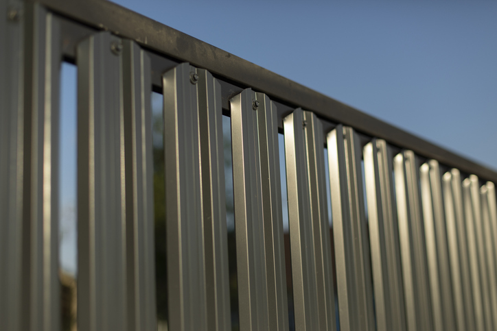 a close up of a metal fence